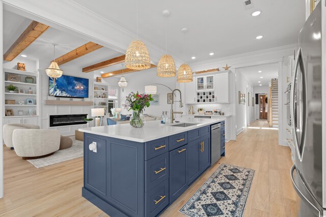 849 Crystal Water Way, Myrtle Beach, SC 29579 - kitchen featuring appliances with stainless steel finishes, a sink, blue cabinetry, white cabinets, and light wood-style flooring