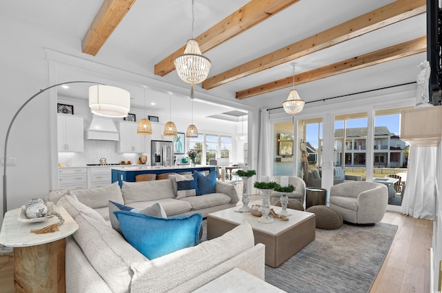 849 Crystal Water Way, Myrtle Beach, SC 29579 - living area featuring light wood-style floors, a chandelier, and beamed ceiling