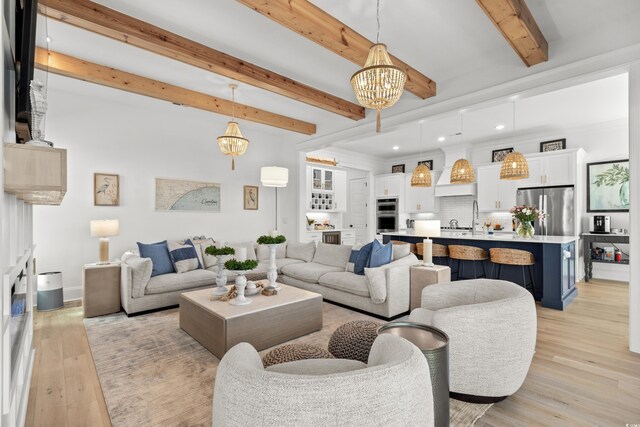 849 Crystal Water Way, Myrtle Beach, SC 29579 - living room with beamed ceiling, a chandelier, light wood-style floors, recessed lighting, and baseboards
