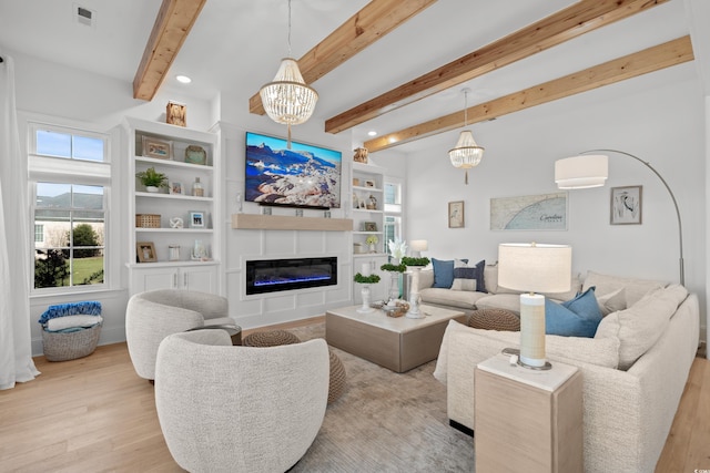 849 Crystal Water Way, Myrtle Beach, SC 29579 - living area with wood finished floors, beamed ceiling, a glass covered fireplace, a chandelier, and recessed lighting