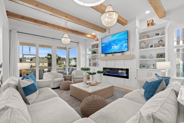 849 Crystal Water Way, Myrtle Beach, SC 29579 - living area with plenty of natural light, beam ceiling, a glass covered fireplace, built in features, and wood finished floors