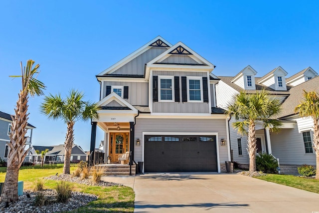 849 Crystal Water Way, Myrtle Beach, SC 29579 - view of front facade featuring board and batten siding, an attached garage, driveway, and a porch