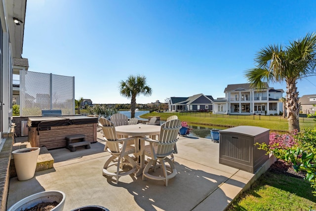 849 Crystal Water Way, Myrtle Beach, SC 29579 - view of patio / terrace with a hot tub, a water view, outdoor dining area, and a residential view