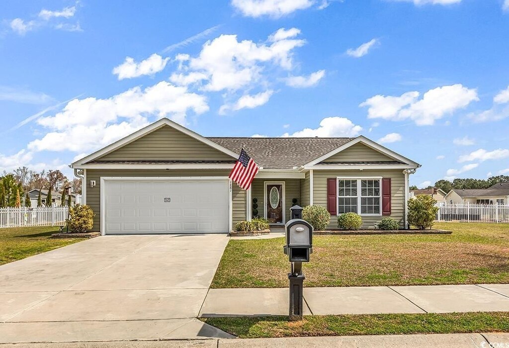 1481 Abberbury Dr, Conway, SC 29527 - ranch-style home featuring driveway, an attached garage, fence, and a front lawn