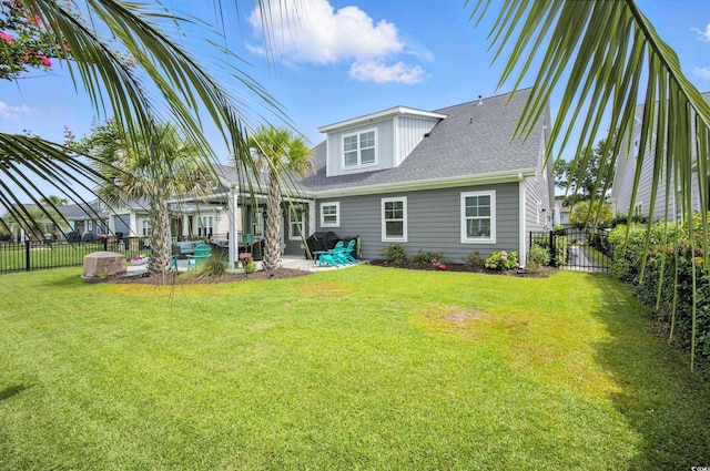 1109 Bonnet Dr, North Myrtle Beach, SC 29582 - back of property with a fenced backyard, a patio, and a shingled roof