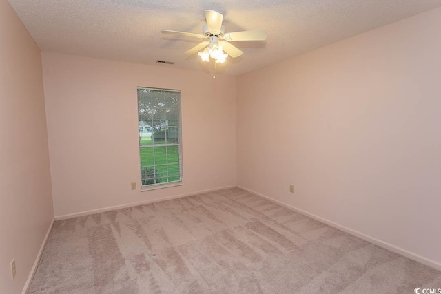 1001 Cardinal Ct, Murrells Inlet, SC 29576 - carpeted empty room with a ceiling fan, baseboards, and a textured ceiling