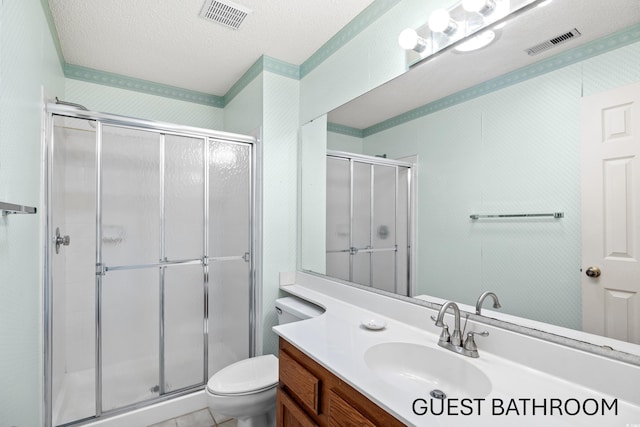 1001 Cardinal Ct, Murrells Inlet, SC 29576 - bathroom with vanity, a stall shower, toilet, and a textured ceiling