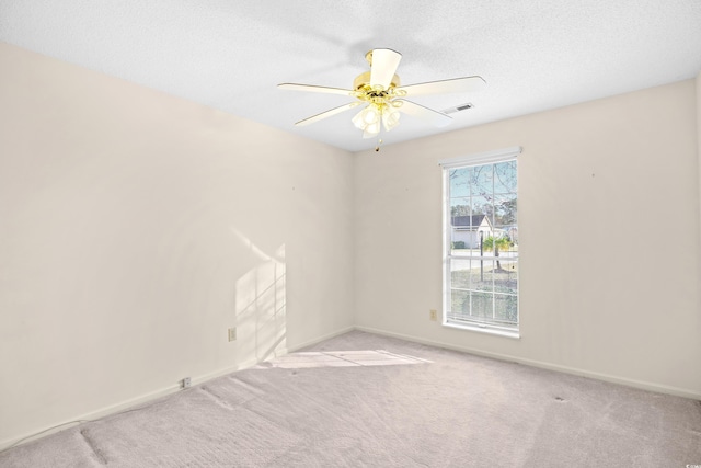 1001 Cardinal Ct, Murrells Inlet, SC 29576 - spare room featuring a ceiling fan, baseboards, carpet, and a textured ceiling