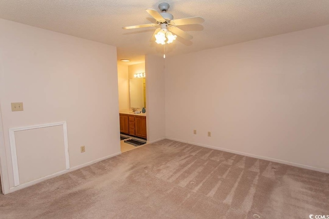1001 Cardinal Ct, Murrells Inlet, SC 29576 - spare room featuring a ceiling fan, light carpet, a textured ceiling, and baseboards