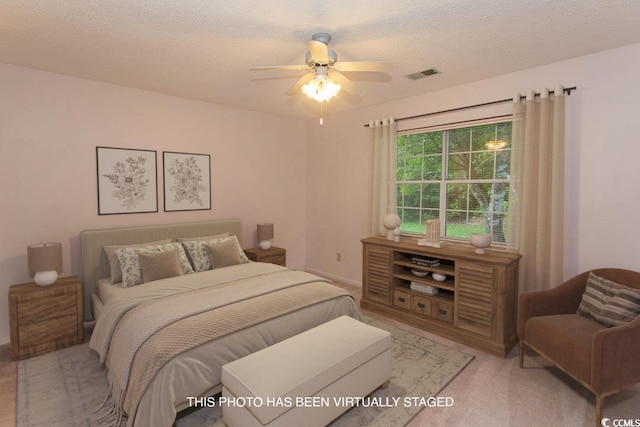 1001 Cardinal Ct, Murrells Inlet, SC 29576 - bedroom featuring a textured ceiling, light carpet, and a ceiling fan