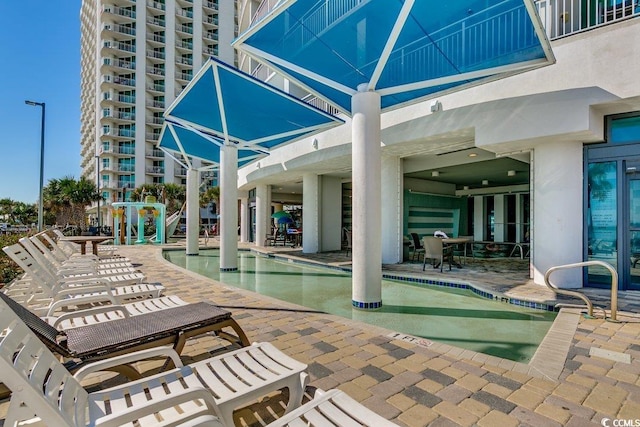community pool with a patio