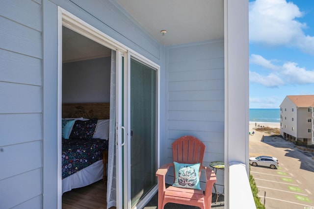 balcony featuring a water view
