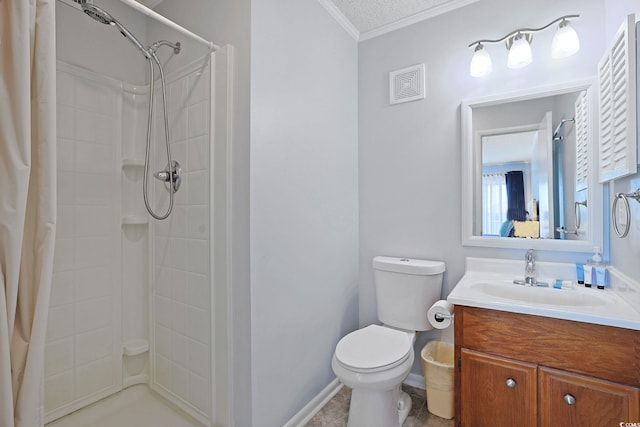 bathroom with vanity, toilet, visible vents, ornamental molding, and tiled shower