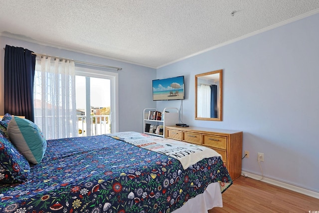 bedroom with baseboards, a textured ceiling, ornamental molding, and light wood-style flooring