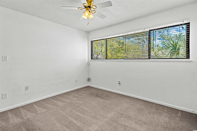 7300 Porcher Dr Unit 11, Myrtle Beach, SC 29572 - spare room with a textured ceiling, carpet flooring, ceiling fan, and baseboards