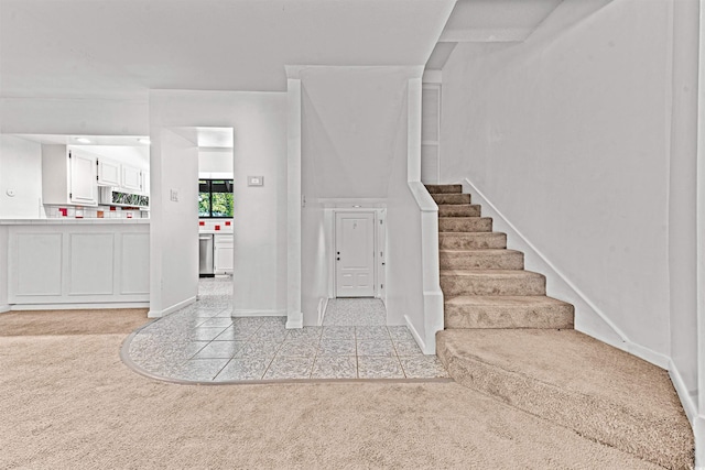 7300 Porcher Dr Unit 11, Myrtle Beach, SC 29572 - entrance foyer featuring light carpet, baseboards, stairs, and light tile patterned flooring