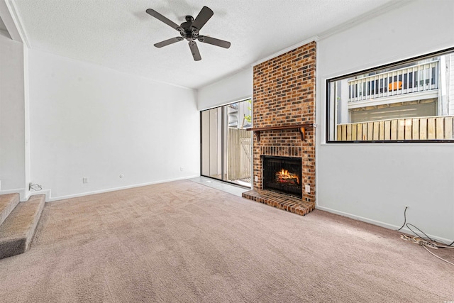 7300 Porcher Dr Unit 11, Myrtle Beach, SC 29572 - unfurnished living room with a textured ceiling, carpet floors, a fireplace, a ceiling fan, and baseboards