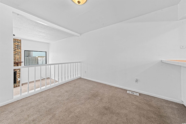 7300 Porcher Dr Unit 11, Myrtle Beach, SC 29572 - carpeted empty room featuring baseboards and a textured ceiling