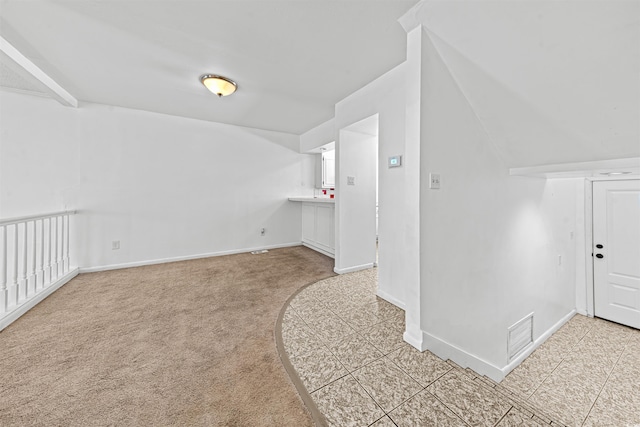 7300 Porcher Dr Unit 11, Myrtle Beach, SC 29572 - additional living space with baseboards, light carpet, and light tile patterned flooring