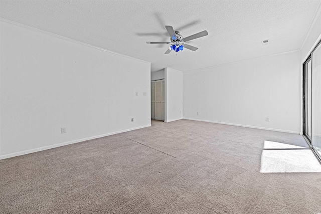 7300 Porcher Dr Unit 11, Myrtle Beach, SC 29572 - unfurnished room featuring a textured ceiling, carpet flooring, a ceiling fan, and baseboards