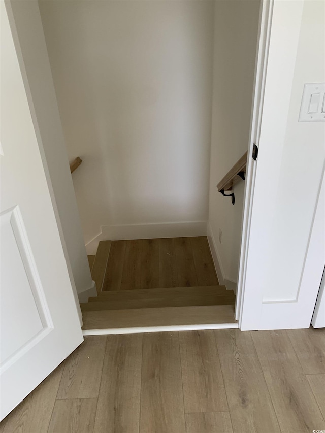 144 Sago Palm Dr, Myrtle Beach, SC 29579 - stairway featuring wood finished floors and baseboards