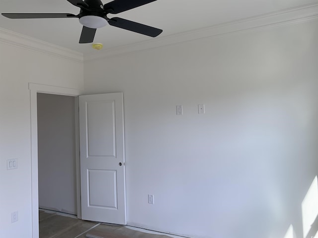 unfurnished room with ceiling fan and ornamental molding