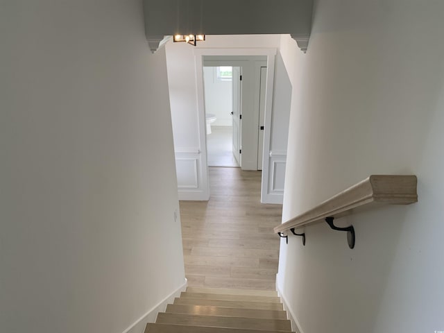 144 Sago Palm Dr, Myrtle Beach, SC 29579 - stairway featuring wood finished floors and a chandelier