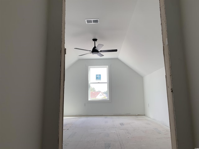 bonus room with lofted ceiling, ceiling fan, and visible vents