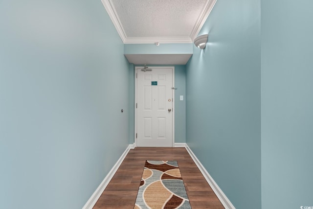 501 S Ocean Blvd Unit 1006, North Myrtle Beach, SC 29582 - doorway to outside featuring a textured ceiling, ornamental molding, dark wood-type flooring, and baseboards