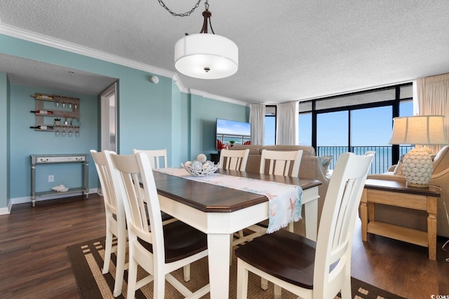501 S Ocean Blvd Unit 1006, North Myrtle Beach, SC 29582 - dining room with wood finished floors, a textured ceiling, crown molding, and baseboards