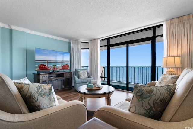 501 S Ocean Blvd Unit 1006, North Myrtle Beach, SC 29582 - living room with crown molding, wood finished floors, and a textured ceiling