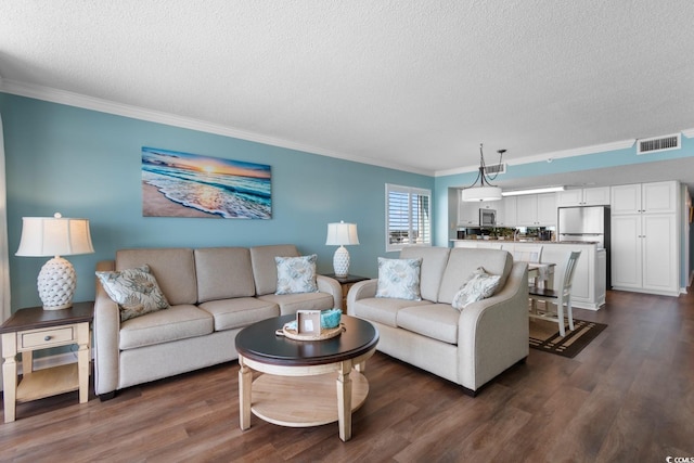 501 S Ocean Blvd Unit 1006, North Myrtle Beach, SC 29582 - living area with a textured ceiling, crown molding, and dark wood finished floors