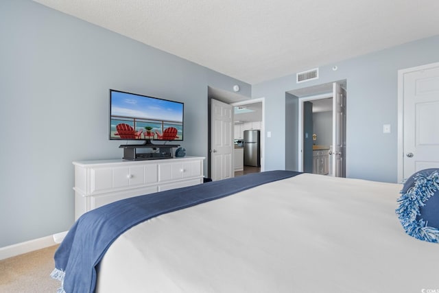 501 S Ocean Blvd Unit 1006, North Myrtle Beach, SC 29582 - carpeted bedroom featuring freestanding refrigerator and baseboards