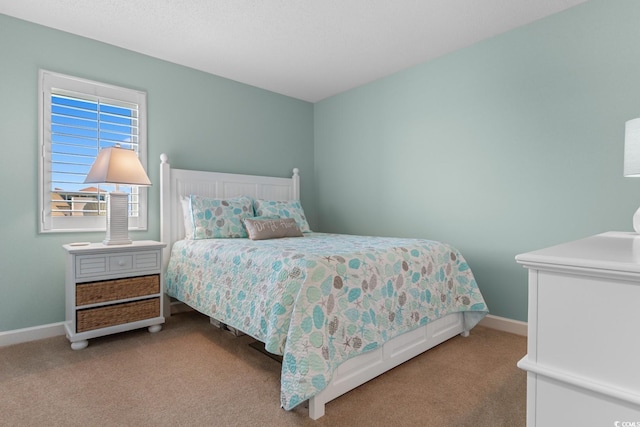 501 S Ocean Blvd Unit 1006, North Myrtle Beach, SC 29582 - carpeted bedroom featuring baseboards