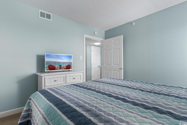 501 S Ocean Blvd Unit 1006, North Myrtle Beach, SC 29582 - bedroom with carpet floors, baseboards, and a textured ceiling