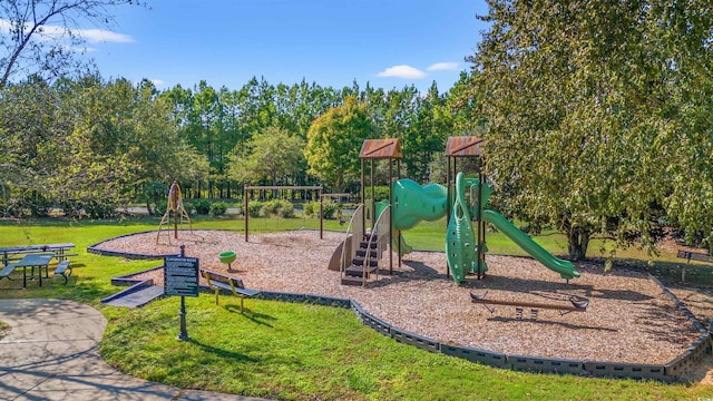 communal playground featuring a lawn
