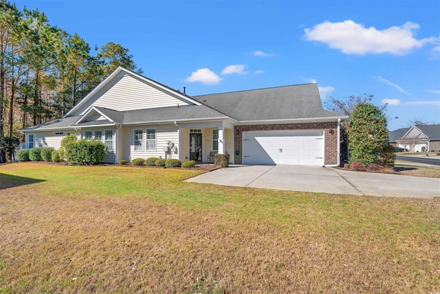 view of front facade featuring a garage, concrete driveway, a front lawn, brick siding, and roof with shingles