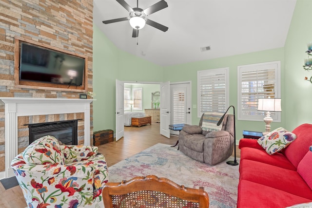 570BOTANYLOOP Murrells Inlt Unit 570, Murrells Inlet, SC 29576 - living room with vaulted ceiling, a ceiling fan, wood finished floors, a large fireplace, and baseboards