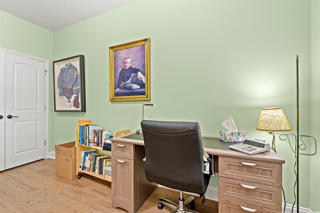 office space featuring light wood-style flooring and baseboards