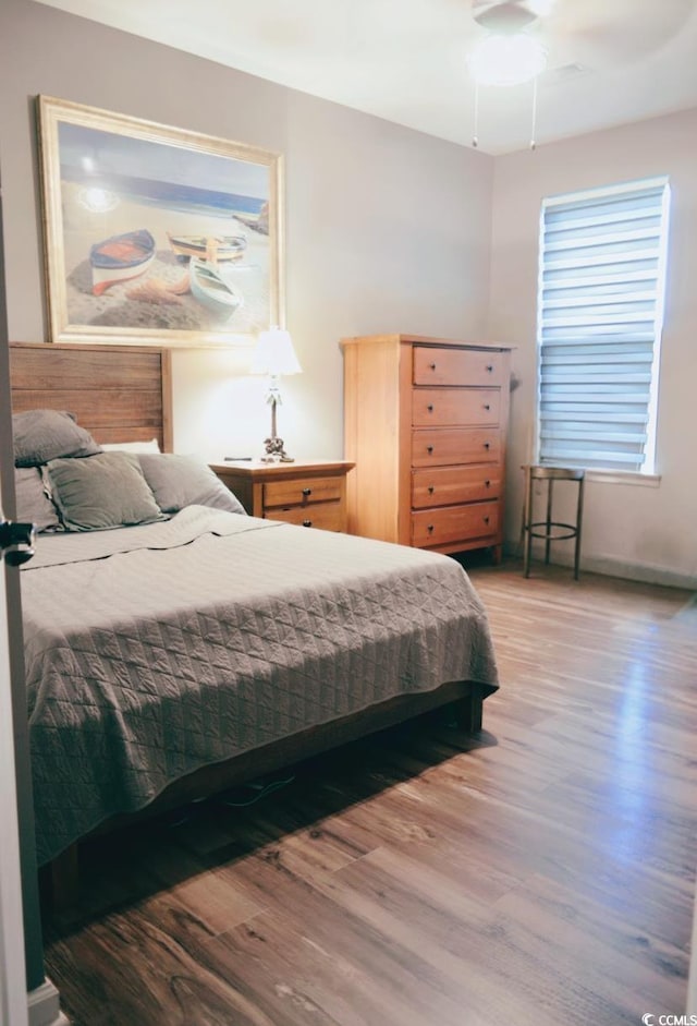 bedroom with light wood-style floors