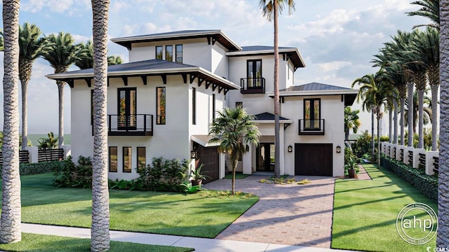 view of front facade featuring a balcony, stucco siding, a standing seam roof, metal roof, and an attached garage