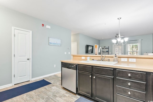 6253 Catalina Dr Unit 713, North Myrtle Beach, SC 29582 - kitchen with stainless steel dishwasher, a sink, a chandelier, light countertops, and hanging light fixtures