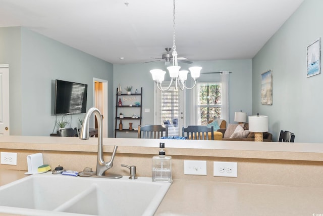 6253 Catalina Dr Unit 713, North Myrtle Beach, SC 29582 - kitchen featuring a sink, a chandelier, open floor plan, and light countertops