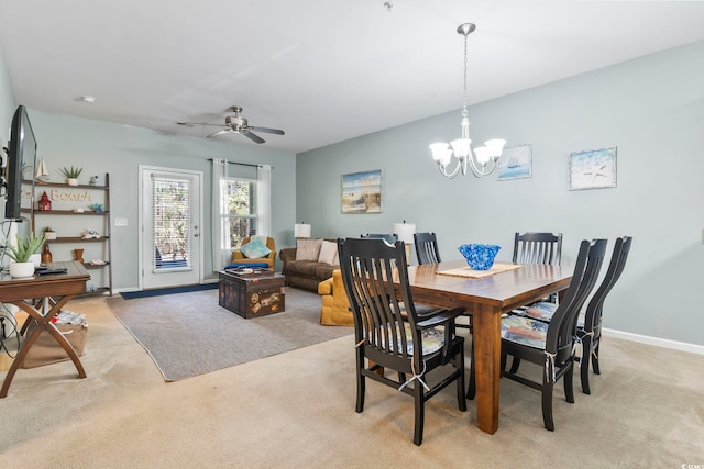 6253 Catalina Dr Unit 713, North Myrtle Beach, SC 29582 - dining area featuring light carpet, a chandelier, baseboards, and a ceiling fan