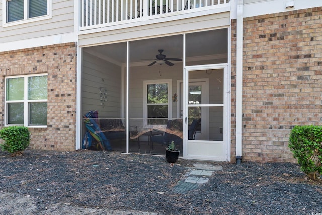 6253 Catalina Dr Unit 713, North Myrtle Beach, SC 29582 - doorway to property featuring brick siding, a balcony, and ceiling fan