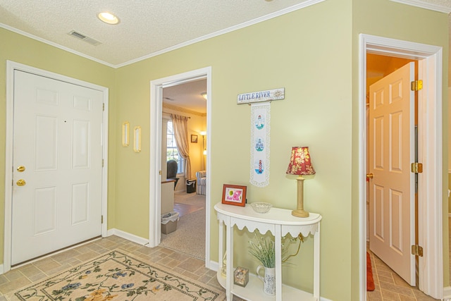 entrance foyer with crown molding, a textured ceiling, recessed lighting, baseboards, and visible vents