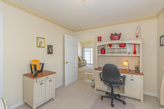 office with baseboards, light carpet, and a textured ceiling