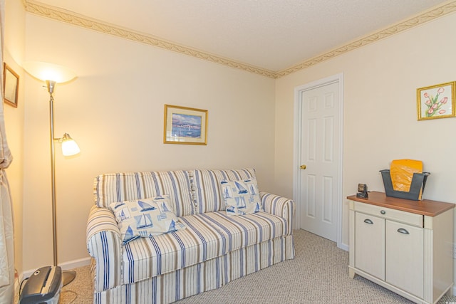 living room featuring baseboards and light carpet