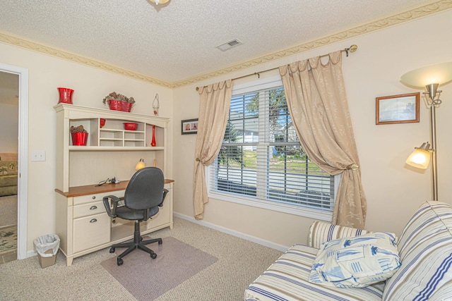 office space with carpet flooring, a textured ceiling, visible vents, and baseboards