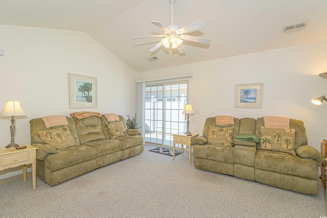 living area with visible vents, carpet floors, vaulted ceiling, and ceiling fan